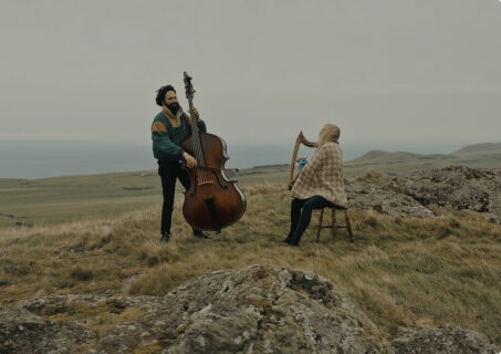 image of 2 musicians on a hill